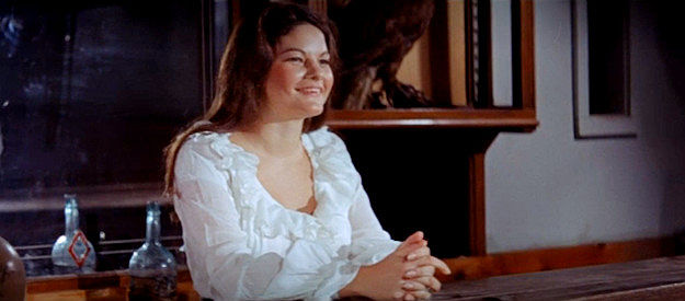 Samantha Worthington as a server happily greeting The Pyscho and his gang to her bar in The Wicked Die Slow (1968)