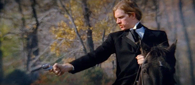 The bounty hunting, two-gun preacher guns down another man in The Wicked Die Slow (1968)