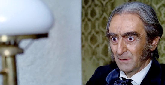 Vincenzo Maggio as the bank director in Brother Outlaw (1971)