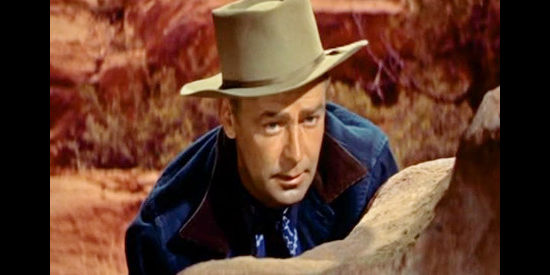 Alan Ladd as Johnny MacKay, trying to track down Captain Jack in Drum Beat (1954)