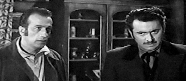 Cec Linder as Dan Carver and Ben Lennick as Jeff Baxter, making a fortune off their government contracts to supply rations to the Sioux in Flaming Frontier (1958)