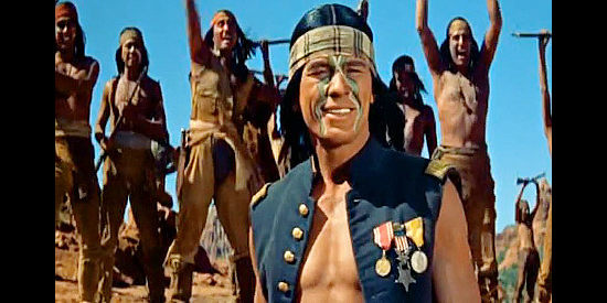 Charles Bronson as Captain Jack, smiling as his warriors rally behind him in Drum Beat (1954)