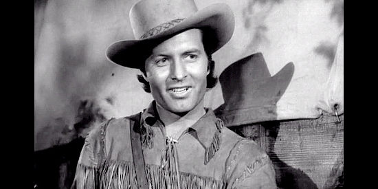 George Montgomery as Davy Crockett, smitten by pretty Frances Oatman in Davy Crockett, Indian Scout (1950)