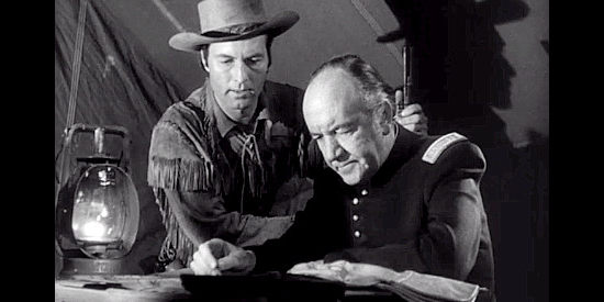 George Montgomery as Davy and Addison Richards as Capt. Weightman, trying to decide the safest route through hostile Indians in Davy Crockett, Indian Scout (1950)