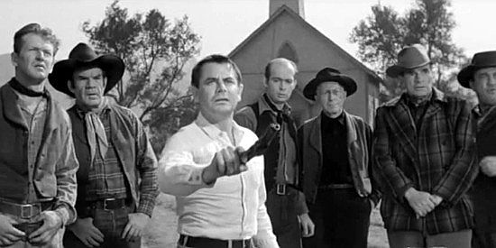 Glenn Ford as George Temple, demonstrating his shooting skill in The Fastest Gun Alive (1956)