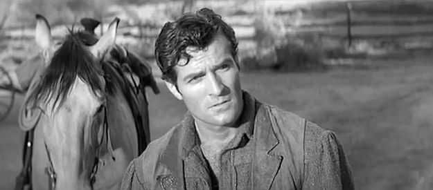 Hugh O'Brian as Daniel Hardy, arriving home with disappointing news for his wife in The Fiend Who Walked the West (1958)
