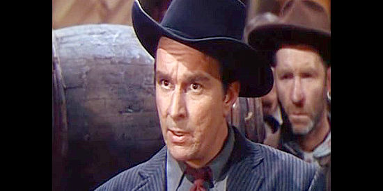 Ian MacDonald as Tombstone Jack, the man Tex suspects of being the Sidewinder behind the Indian raids in Flaming Feather (1952)