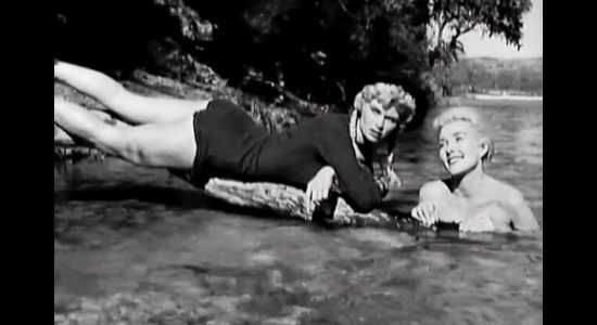 Irish McCalla as 'Big Pearl' Jackson and Kathy Marlow as 'Faro' Kitty Brewster, trying to use the art of seduction to escape cusstody in Five Bold Women (1959)