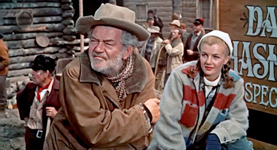 Jay C. Flippen as Rube Morris and Corinne Calvet as Renee Vallon, gold-hunting partners in The Far Country (1954)