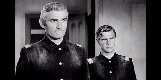 Jeff Chandler as Maj. Drango and John Lupton as Capt. Banning, making their introductions to the Allen family in Drango (1957)