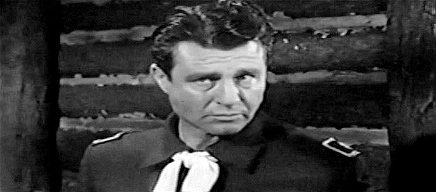 Jim Davis as Col. Hugh Carter, the glory-hungry cavalry officer who isn't eager to see anything curb hostilities with the Sioux in Flaming Frontier (1958)