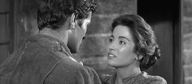 Linda Cristal as Ellen Hardy, voicing her concerns about Felix Griffin to her husbands in The Fiend Who Walked the West (1958(
