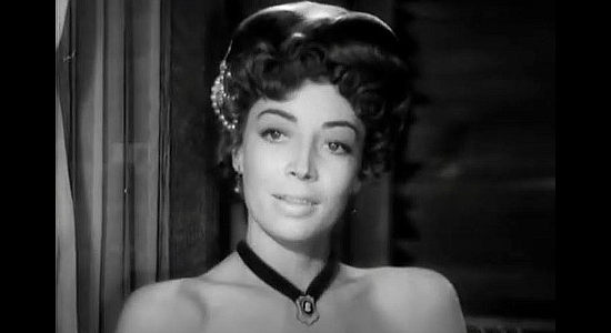 Marie Windsor, singing in a cantina south of the border to stay out of trouble in Dakota Lil (1950)