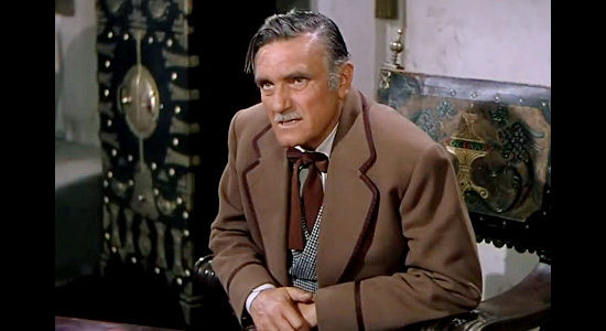 Morris Ankrum as Thomas Ainsworth, pretending not to know why Jan Morrell would have anything against him in The Raiders (1952)