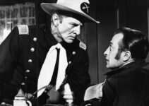 Bruce Bennett as Cap. Jim Hewson warning Dan Caver to stop cheating the Sioux on their rations in Flaming Frontier (1958)
