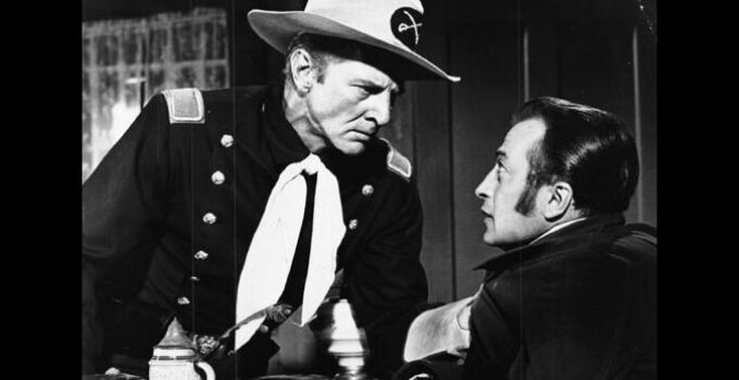 Bruce Bennett as Cap. Jim Hewson warning Dan Caver to stop cheating the Sioux on their rations in Flaming Frontier (1958)