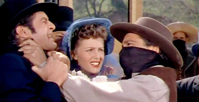 Hugh O'Brian as Hank Purvis, Barbara Britton as Elizabeth Ainsworth and Richard Conte as Jan Morrell in The Raiders (1952)