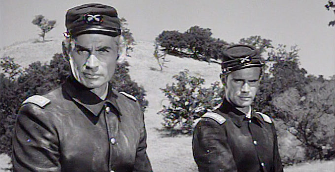 Jeff Chandler as Maj. Drango and John Lupton as Capt. Banning in Drango (1957)
