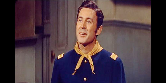 Peter Hansen as Lt. Goodsall, the young officer who shows an interest in Nancy Meek in Drum Beat (1954)