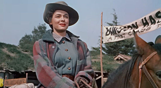 Ruth Roman as Ronda Castle, arriving in Dawson with plans to go into business there in The Far Country (1954)
