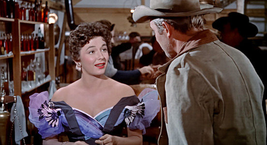 Ruth Roman as Ronda Castle, the businesswoman who takes an immediate liking to Jeff Webster in The Far Country (1954)