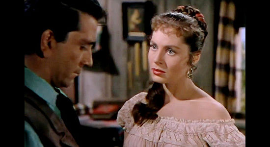 Viveca Lindfors as Elena de Ortega, trying to convince Jan Morrell to give up his mission of vengeance in The Raiders (1952)