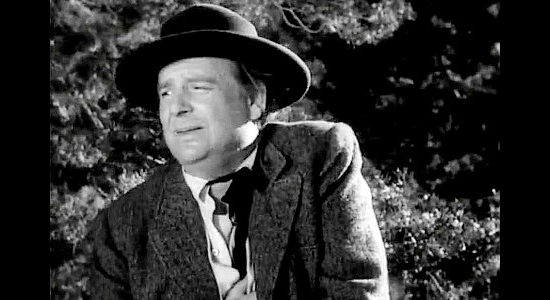 Wallace Ford as Carter, Tom Horn's federal assistant, grimacing from a wound suffered in a scrape with the Hole in the Wall gang in Dakota Lil (1950)