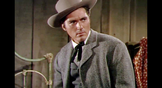 William Bishop as Marshal William Henderson, trying to find those responsible for gold heists in The Raiders (1952)