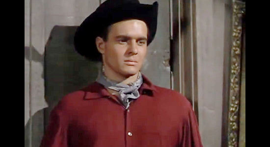 William Reynolds as Frank Morrell, breaking news of Mary Morrell's death to brother Jan Morrell in The Raiders (1952)