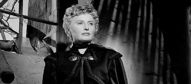 Barbara Stanwyck as Jessica Drummond, caught in a twister of her own making in Forty Guns (1957)