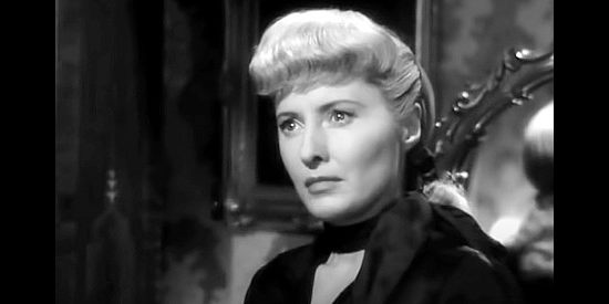 Barbara Stanwyck as Vance Jeffords, reacting to Flo Burnett's suggestion that she leave the Furies for a tour of Europe in The Furies (1950)