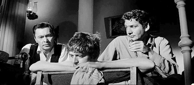 Barry Sullivan as Griff Bonnell and Gene Barry as Wes Bonnell talking to younger brother Chico (Robert Dix) in Forty Guns (1957)