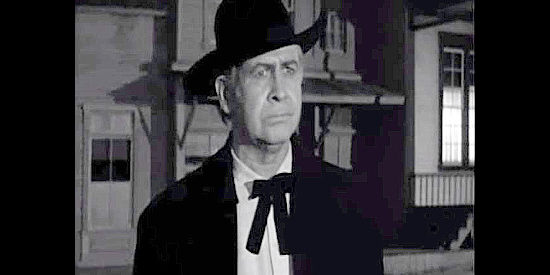 Barton MacLane as Simon Crayle, fearful that his son's new job amounts to a suicide mission in Frontier Gun (1958)