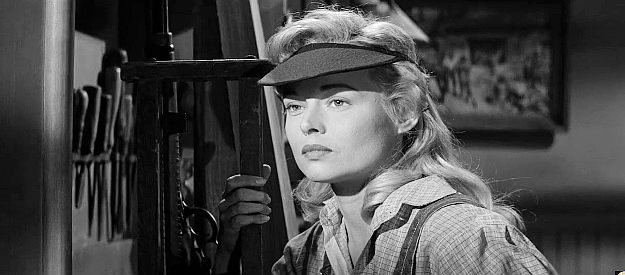 Eve Brent as Louvenia Spangler, the lady gunsmith who wants to fit Wes Bonnell with the perfect rifle in Forty Guns (1957)