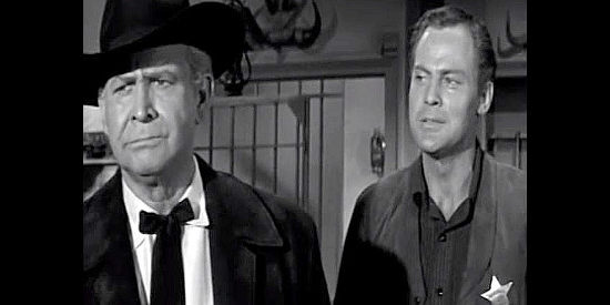 John Agar as JIm Crayle, explaining to his dad (Barton MacLane) why his new job as sheriff of Honcho is so important in Frontier Gun (1958)