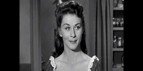 Joyce Meadows as Peg Barton, finally finding a man she can love when Jim Crayle arrives in Frontier Gun (1958)