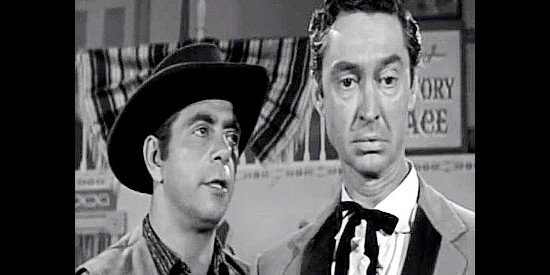 Robert Strauss as Yubo, trying to coerce barfly Cash Skelton (James Griffith) into doing his bidding in Frontier Gun (1958)