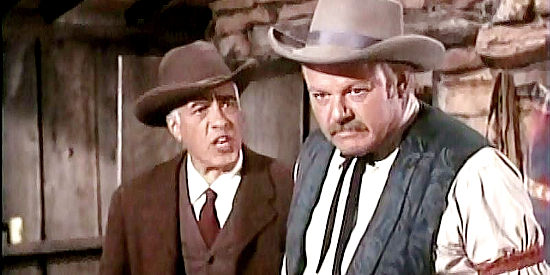 Alan Hale Jr. as Leach, trying to beat information out of Lottie over the objections of Tucker (Edward Platt) in Bullet for a Badman (1964)