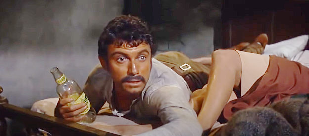 Anthony Franciosa as Juan Luis Rodriguez, his time with woman and drink interrupted in Rio Conchos (1964)
