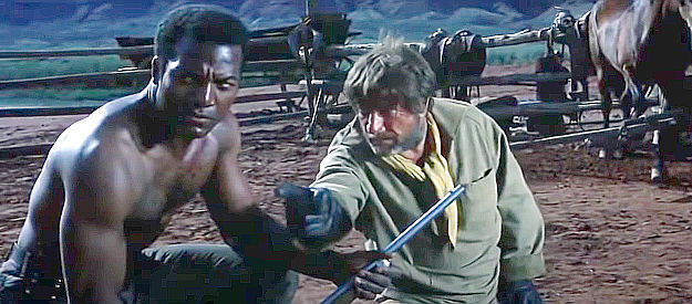 Jim Brown as Sgt. Franklyn and former Confederate Jim Lassister (Richard Boone) fighting on the same side in Rio Conchos (1964)