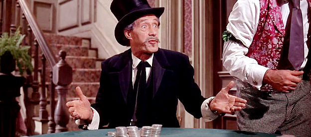 John Carradine as Jeff Blair, proclaiming innocence when a card goes missing during a Dodge City poker game in Cheyenne Autumn (1964)