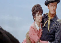 Suzanne Pleshett as Kitty Mainwarring being rescued by Lt. Matt Hazard (Troy Donahue) in A Distant Trumpet (1964)