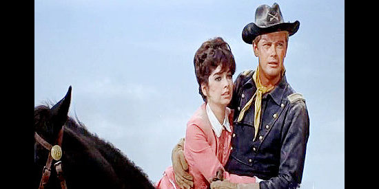 Suzanne Pleshett as Kitty Mainwarring being rescued by Lt. Matt Hazard (Troy Donahue) in A Distant Trumpet (1964)