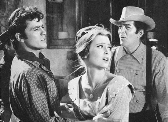 Alain Delon as Don Andrea Baldazar, Rosemary Forsyth as Phoebe Ann and Dean Martin as Sam Hollis in Texas Across the River (1966)