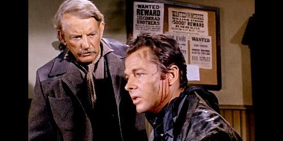 Audie Murphy as Chad Lucas, returning wounded after he and deputy Cap (Denver Pyle) failed to stop a railroad holdup in Gunpoint (1966)