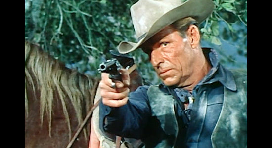 Buster Crabbe as outlaw Mike Clayman, turning the table son those who wanted to collect his bounty in The Bounty Killer (1965)