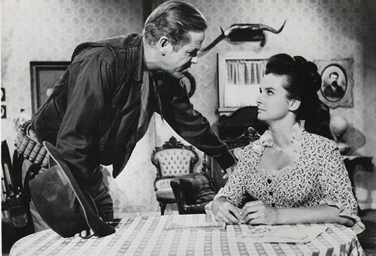 Dan Duryea as Willie Duggans with Audrey Dalton as Carole Ridgeway in The Bounty Killer (1965)