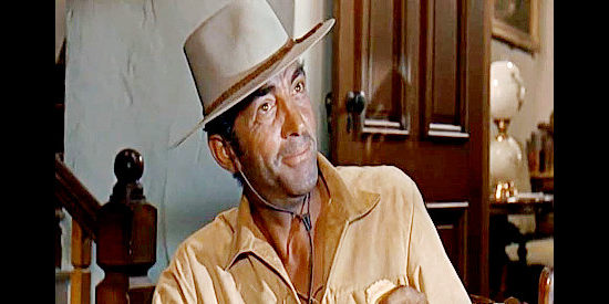 Dean Martin as Alex Flood, the man who insists on owning 51 percent of everything in Rough Night in Jericho (1967)