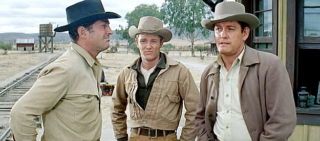 Dean Martin as Tom Elder with brothers Bud (Michael Anderson Jr.) and Matt (Earl Holliman), awaiting a train in The Sons of Katie Elder (1965)