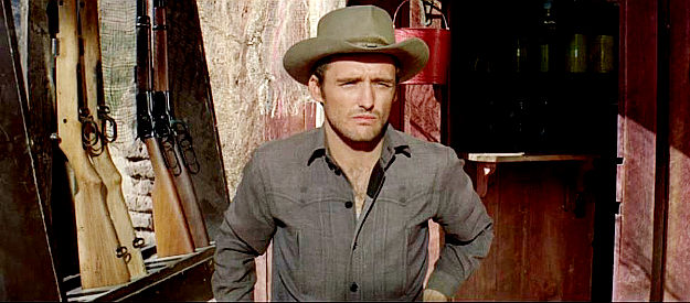 Dennis Hopper as Dave Hastings, bothered by his father's means of attaining power and wealth in The Sons of Katie Elder (1965)